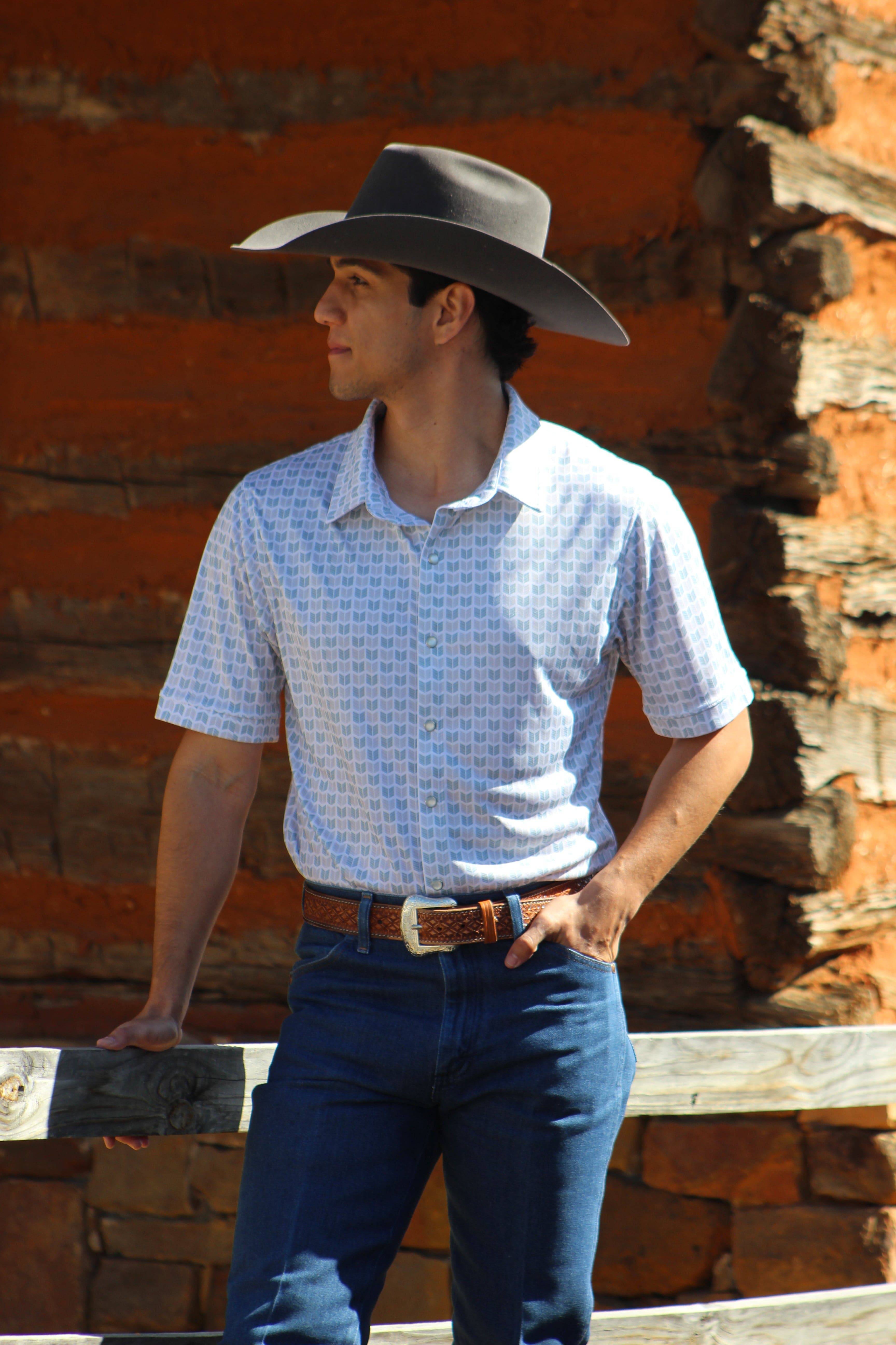 A model wearing the Howdy-Ho Arctic Sky Arrows shirt, styled with dark jeans, demonstrating the shirt's fit and versatility for a casual, sharp look.
